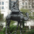 bronze arab on camel with dogs sculpture